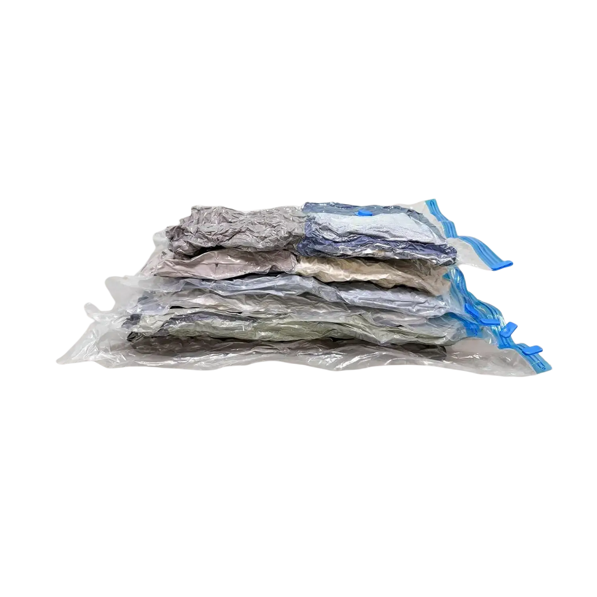 Stack of clear vacuum storage bags with blue zipper pulls and metallic silver interiors for clothes and blankets