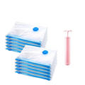 Ten transparent vacuum compression bags with blue seals and valve caps and a pink hand pump for storage use
