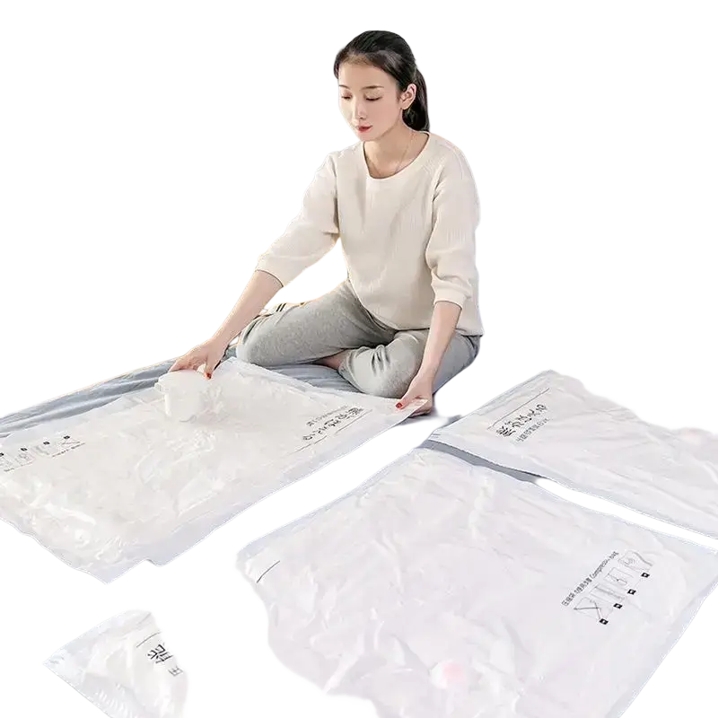 White plastic vacuum storage bags with pa+pe material featuring chinese text and icons for space saving use
