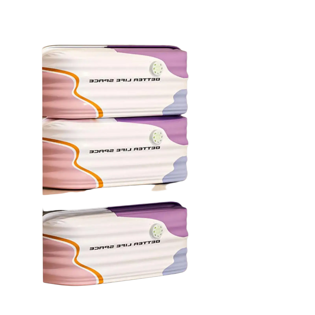 Three stacked soft-sided vacuum storage bags with white base and pastel pink purple lavender wave patterns and orange accents