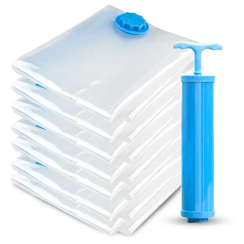 Set of clear plastic blue cap vacuum storage bags with matching bright blue hand pump for space saving clothes
