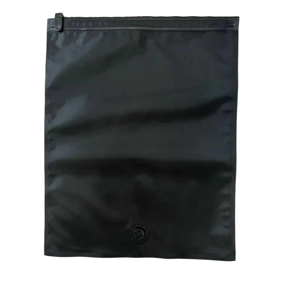 Black roll vacuum bag made of glossy lightweight material with a small circular logo for travel compression storage
