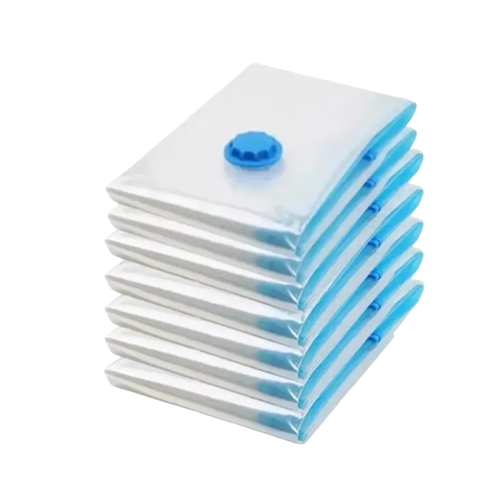 Stack of seven translucent white vacuum storage organizer bags with blue valves for clothes bedding and camping equipment