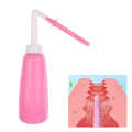 Pink plastic vaginal anal wash bottle with white cap and curved nozzle made of eva soft plastic