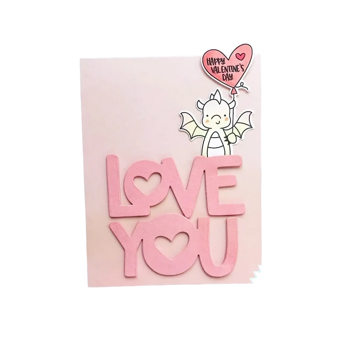 Valentine dragon clear stamps and dies set featuring white dragon with pink balloon and pink love you die cut letters