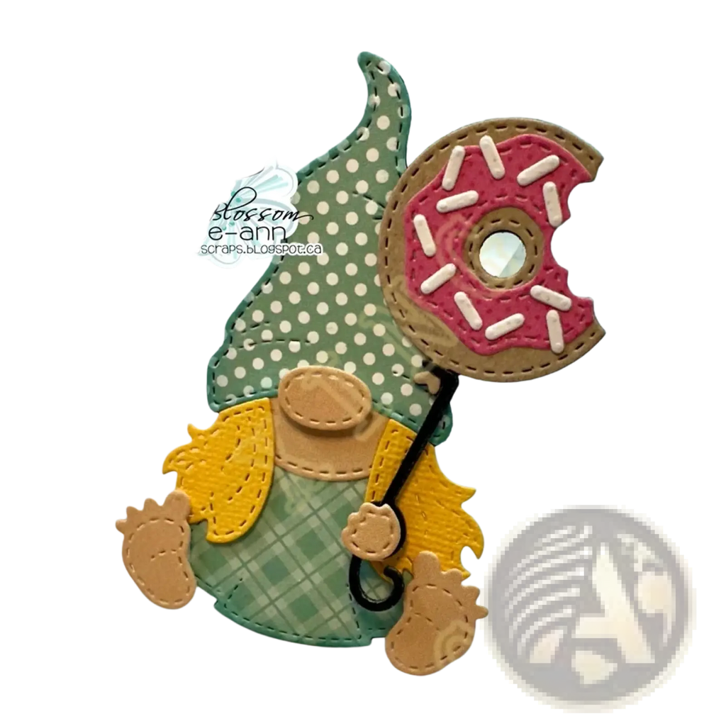 Valentine gnome metal cutting dies and stamps featuring a green and yellow gnome with a polka-dot hat holding a pink frosted donut