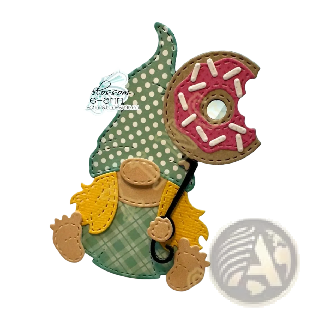 Valentine gnome metal cutting dies and stamps featuring a green and yellow gnome with a polka-dot hat holding a pink frosted donut