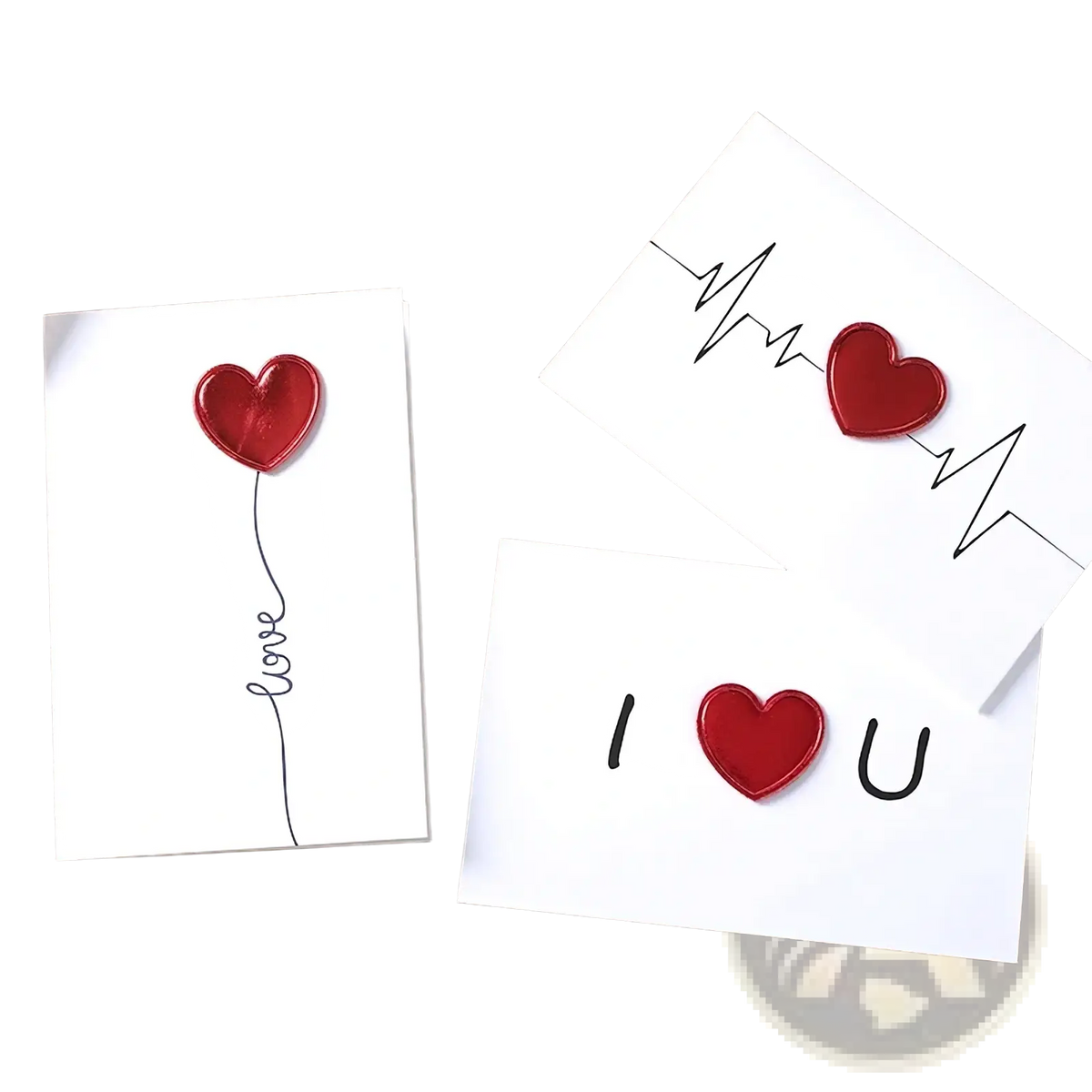White valentine greeting cards with glossy red heart embellishments and minimalist black line art designs
