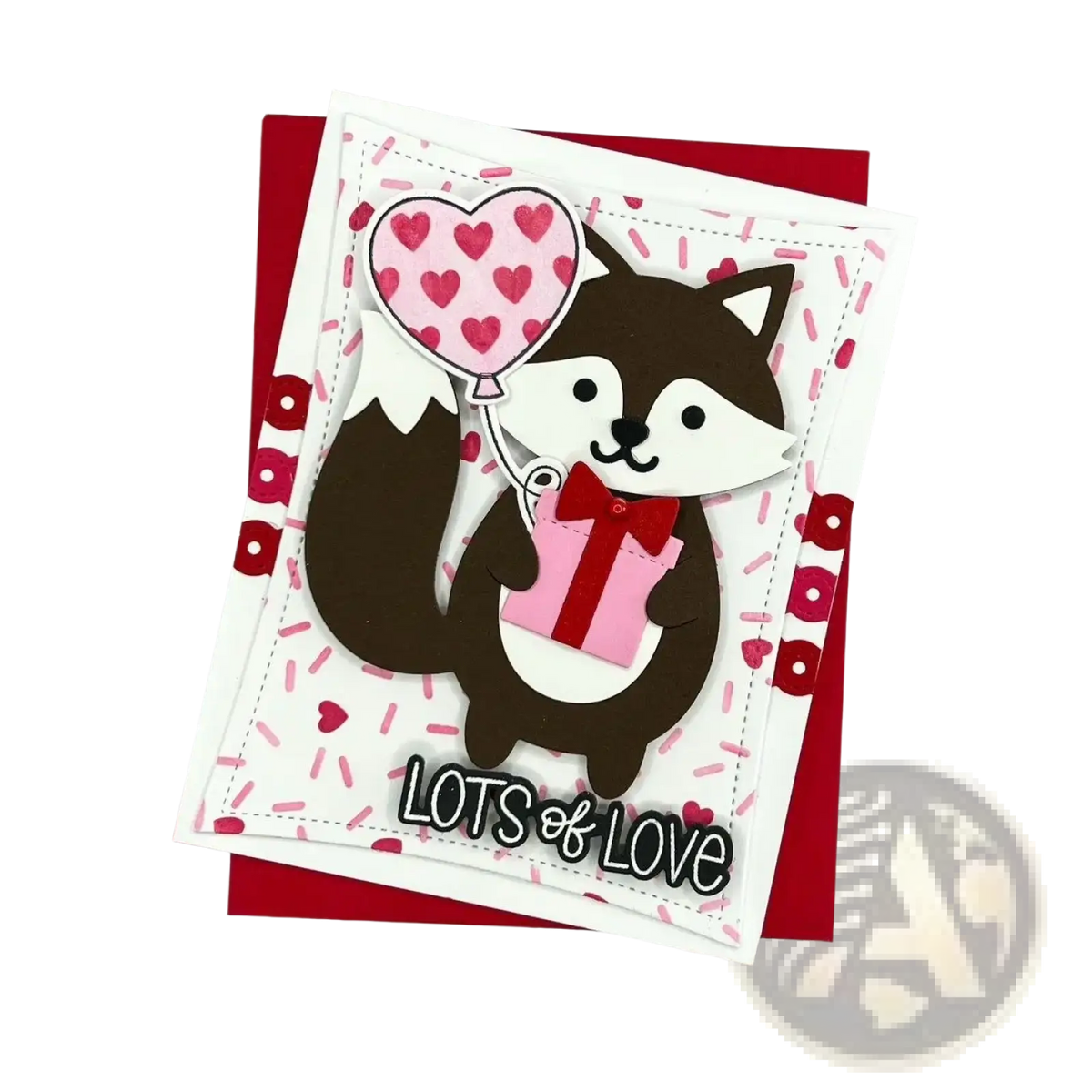 Valentine metal cutting dies and clear stamps set with a brown and white fox paper craft card holding a pink gift box