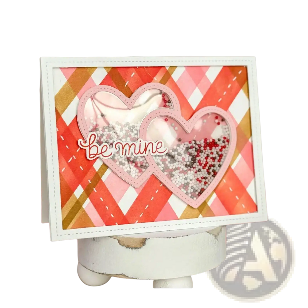Valentine metal cutting dies and clear stamps set featuring a pink and white heart-shaped shaker card with red beads