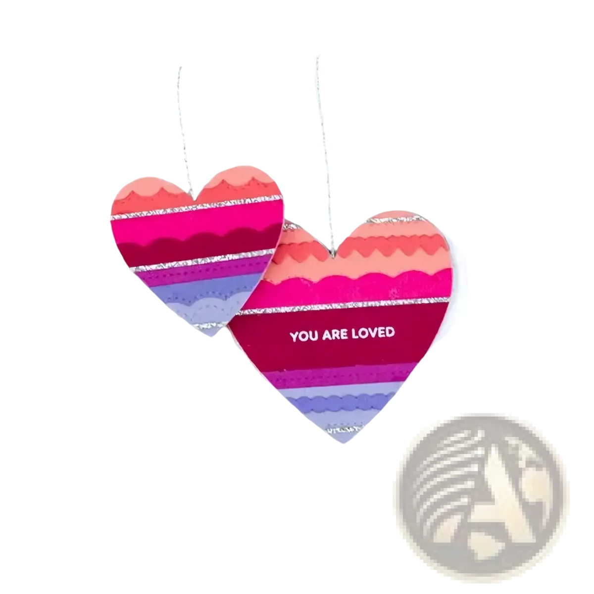 Valentine metal cutting dies and clear stamps set featuring a vibrant heart-shaped ornament with pink and purple stripes and silver glitter edges