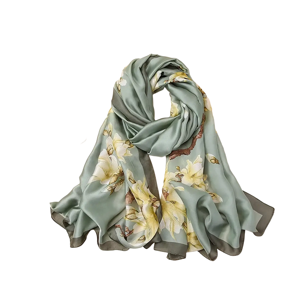 A soft sage green silk scarf with delicate yellow and brown floral patterns inspired by van gogh almond blossom