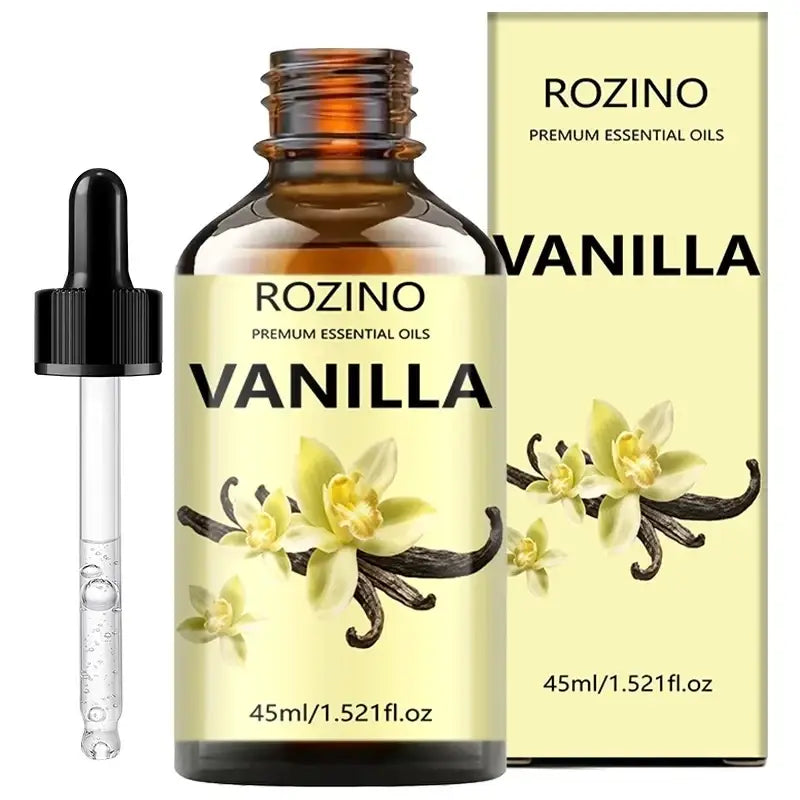 A 45ml amber glass bottle of rozino premium vanilla essential oil with black dropper and pale yellow skin care packaging