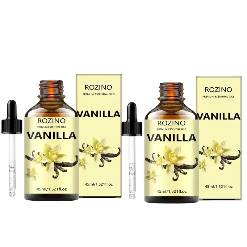 Two amber glass bottles of rozino vanilla essential oil with black dropper caps for skin care and massage use