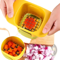 Yellow plastic vegetable chopper with metal grid and green base for cutting carrots into uniform cubes manual slicer tool