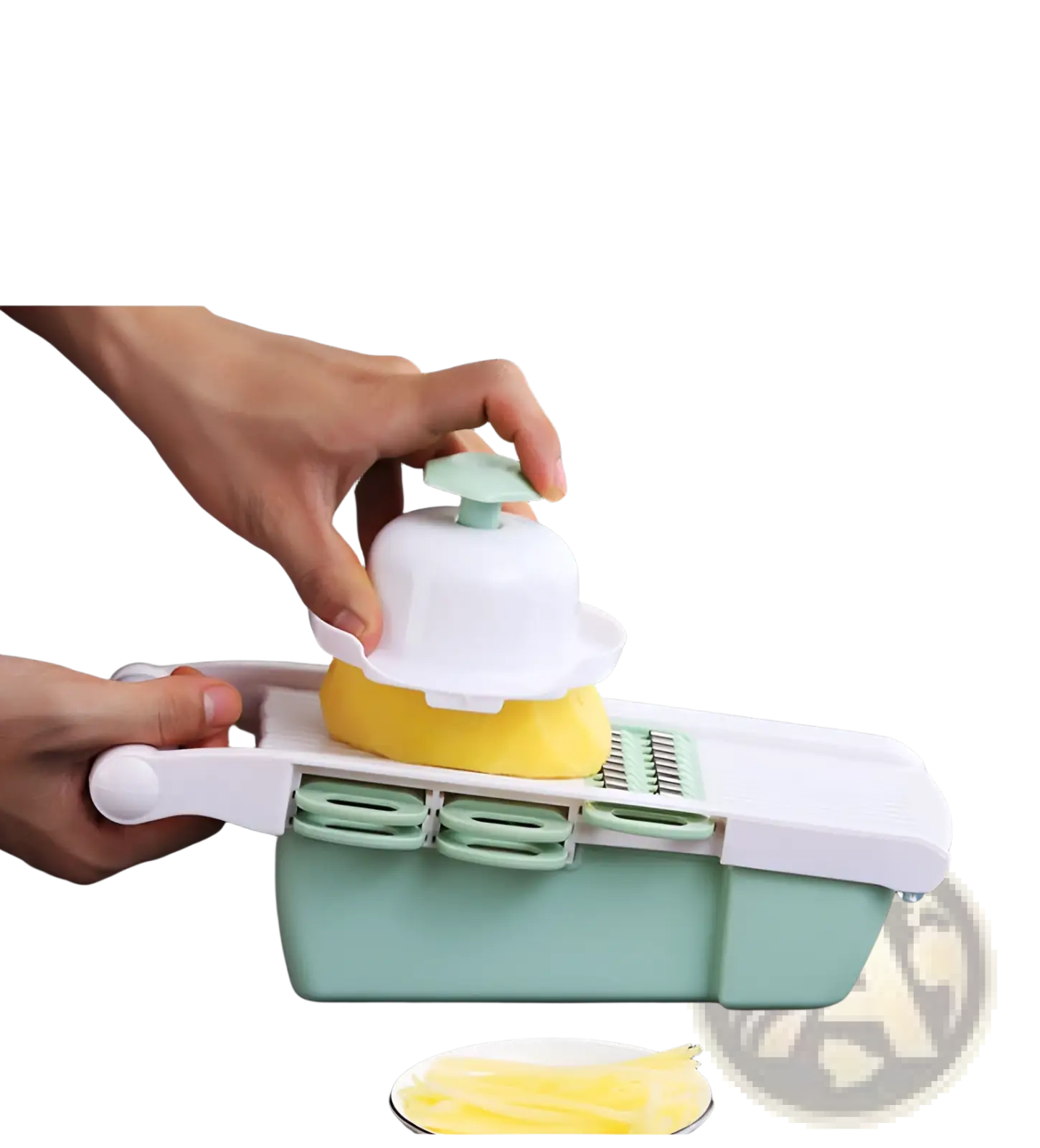 Vegetable slicer mandoline grater with blades in white and mint green slicing a yellow potato into thin strips