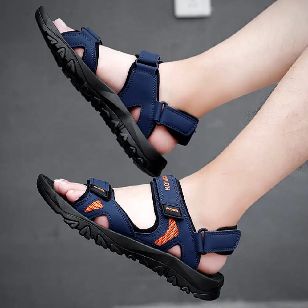 Men’s breathable athletic velcro beach sandals in navy blue and orange with black rubber soles for outdoor use