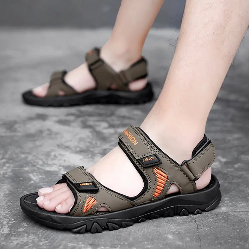 Men’s breathable athletic velcro beach sandals in olive green and orange with black rubber soles