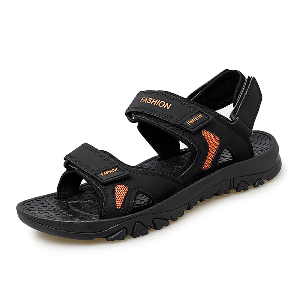 Men’s breathable athletic velcro beach sandals in black and orange with mesh accents and a textured rubber sole