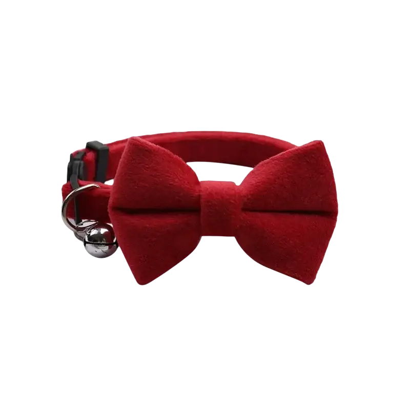 Red velvet bow cat collar with a silver bell showcasing elegant velvet material and festive design for pets