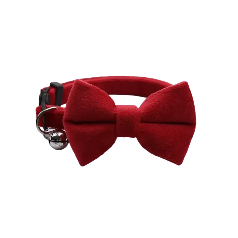 Red velvet bow cat collar with a silver bell made of soft velvet material for stylish pet accessories