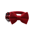 Red velvet bow cat collar with a silver bell made of soft velvet material for stylish pet accessories