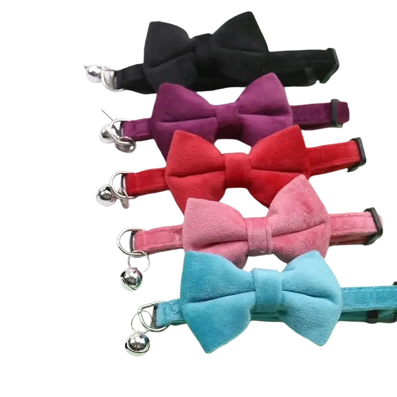 A set of five velvet bow tie cat collars in assorted colors with silver bells and adjustable buckles
