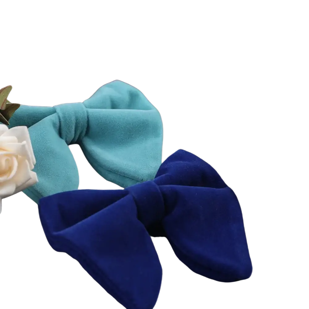 A collection of vibrant velvet bow ties in maroon red teal brown royal blue and black for formal neckwear gifts