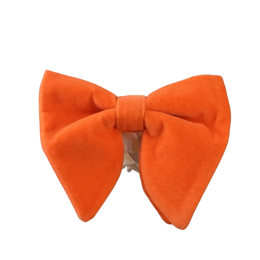 A vibrant orange velvet bow tie with soft plush texture and symmetrical design for formal neckwear gift