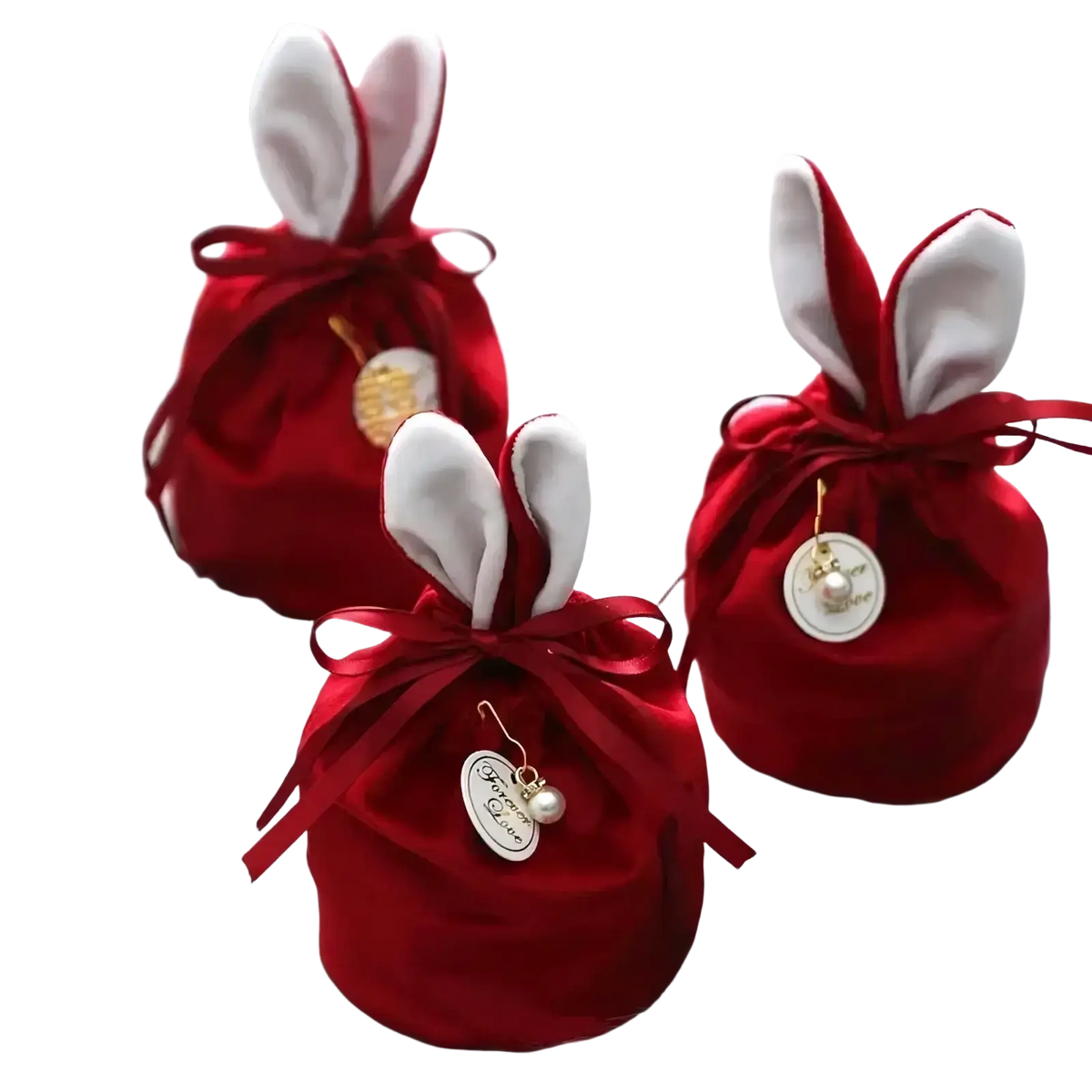 Red velvet bunny easter candy bag with white fabric ears and satin ribbon bows for festive candy packaging