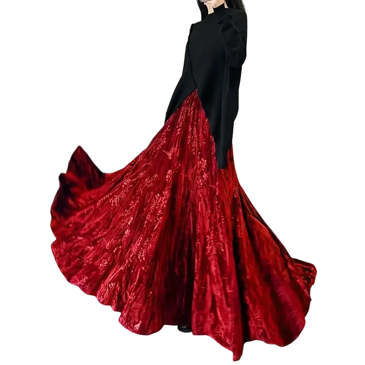 A flowing deep red velvet high waist midi skirt with pleated a-line design and intricate floral embroidery