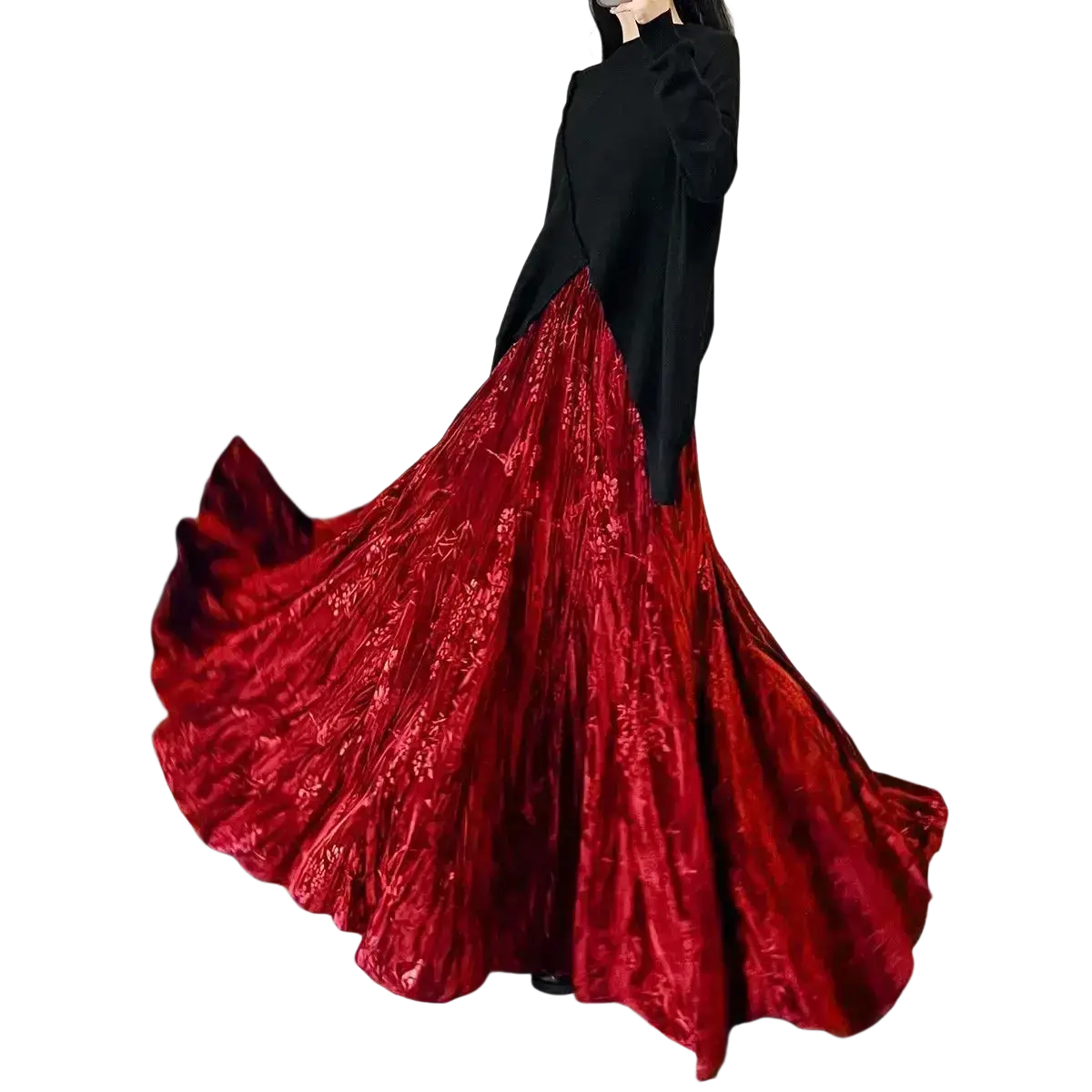 A flowing deep red velvet high waist midi skirt with an intricate floral pattern and pleated a-line design