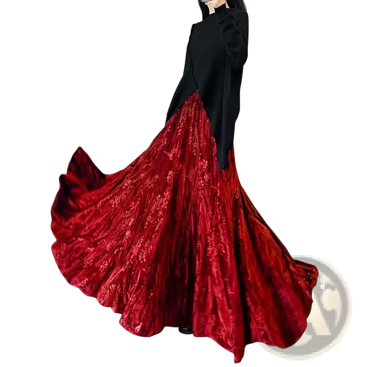 A flowing deep red velvet high waist pleated a-line midi skirt with intricate floral embroidery and a high slit