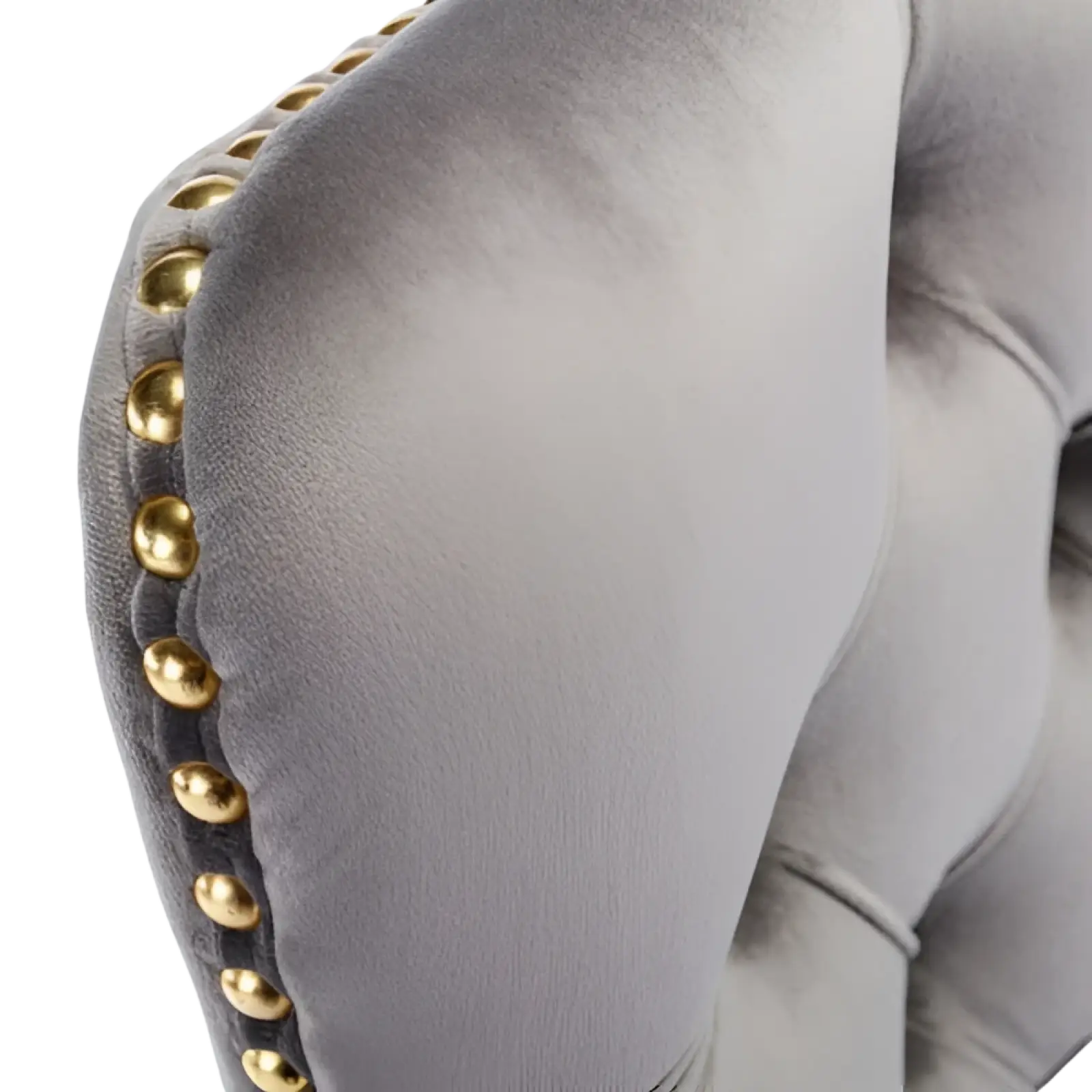 Gray velvet office chair armrest with gold toned nailhead trim showcasing tufted design and swivel functionality