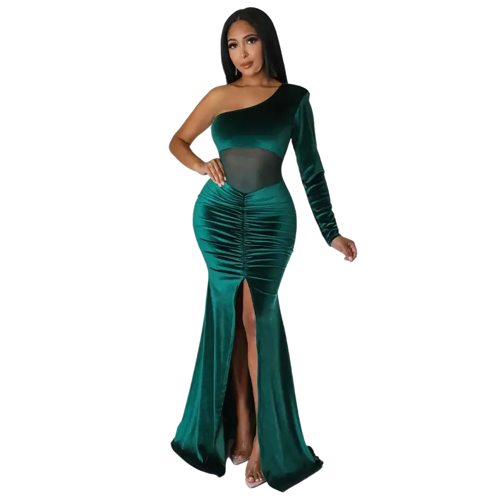Emerald green velvet one shoulder mermaid evening gown with sheer mesh panel and high slit for formal events