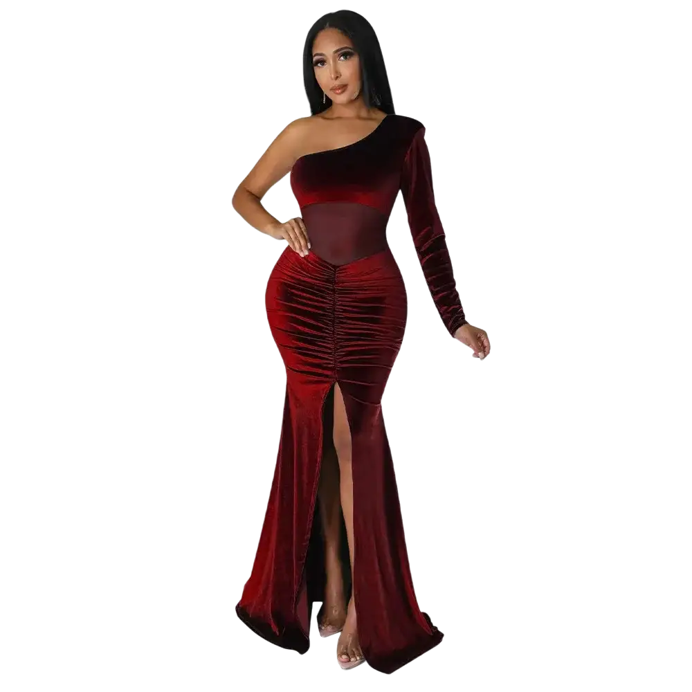 A luxurious burgundy velvet one shoulder mermaid evening gown with a high slit and ruched bodice
