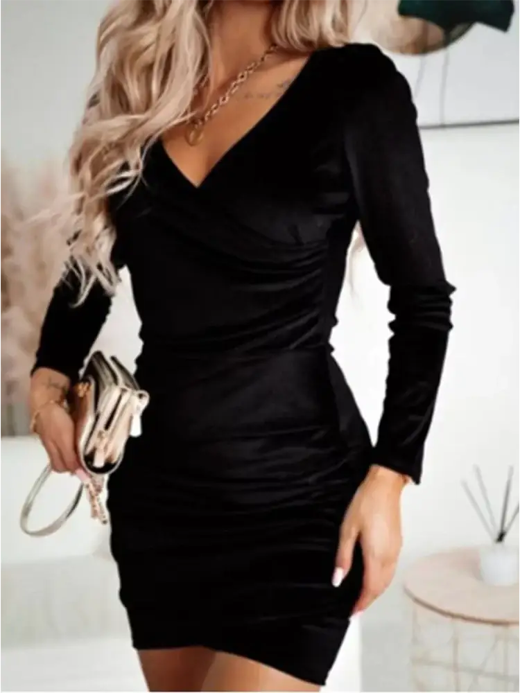 Black velvet long sleeve mini dress with v-neckline in a bodycon fit perfect for elegant evening wear