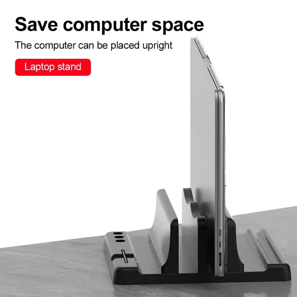 Black and gray plastic vertical laptop stand with multiple charging port slots for adjustable desktop organization