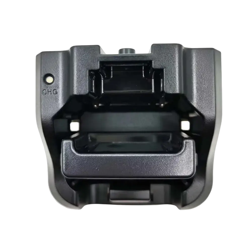 Black plastic vhf marine radio charger cradle with molded contours and chg indicator light for rs-38m model