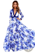 A flowing white vintage blue floral v neck maxi dress with navy trim along neckline waistband and cuffs