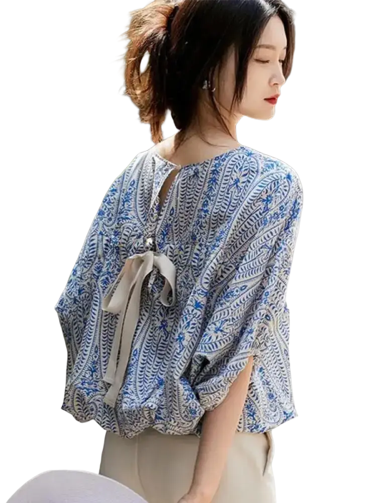 Vintage bow batwing chiffon blouse back view featuring flowing blue and white pattern with tied bow detail