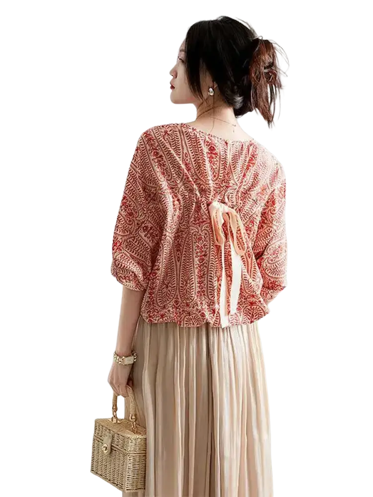 Vintage bow batwing chiffon blouse shown from the back with soft peach color and red white embroidered patterns tied with fabric ties