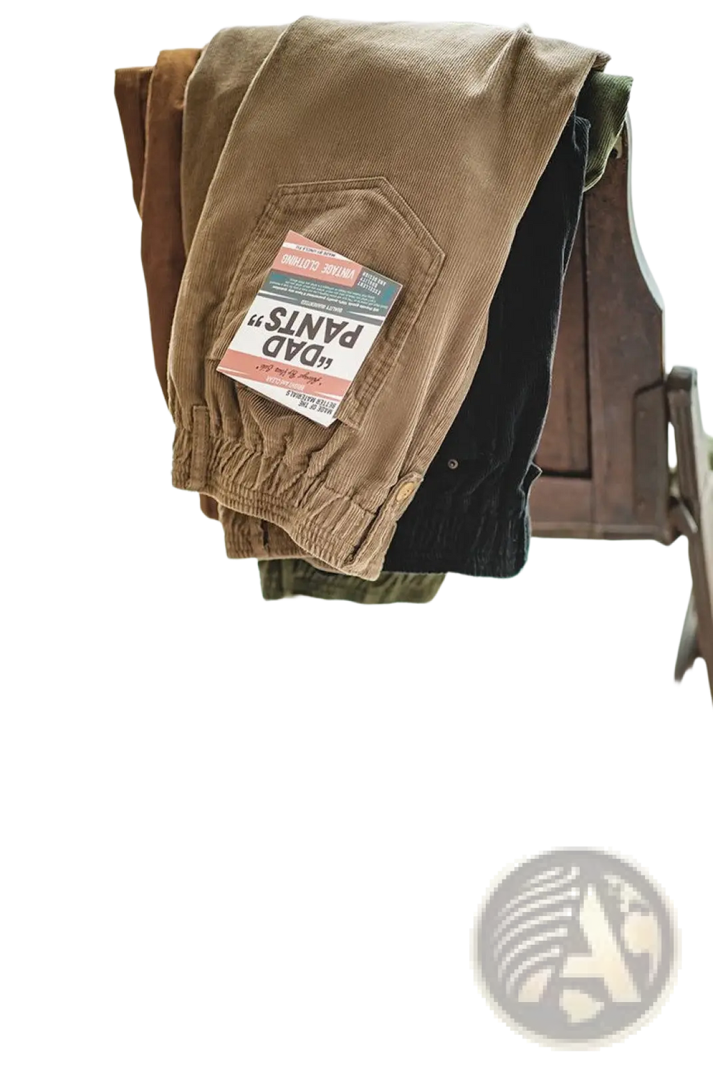 A pair of vintage brown corduroy cargo pants with a front pocket featuring a dad pants label