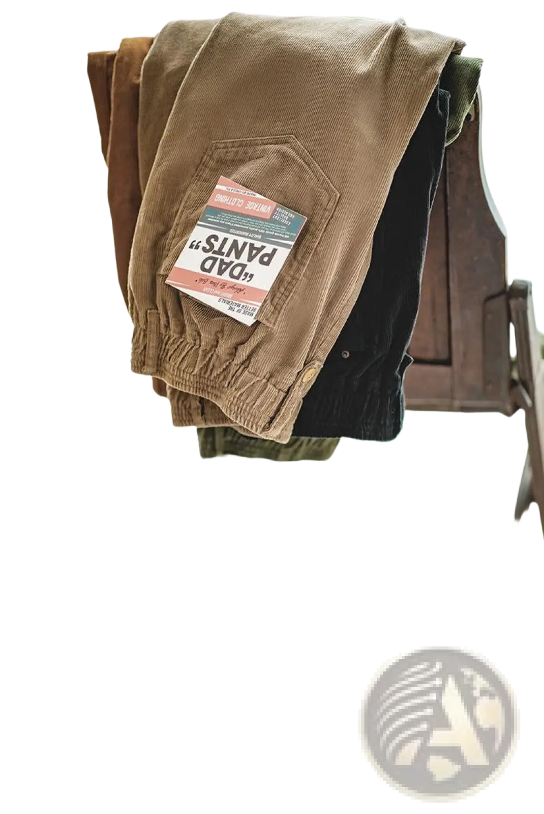 A pair of vintage brown corduroy cargo pants with a front pocket featuring a dad pants label
