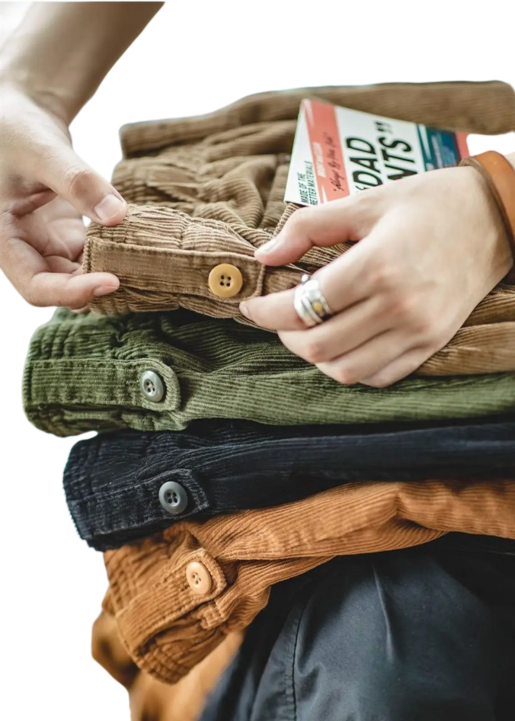 Stacked vintage brown corduroy cargo pants in earthy tones featuring button closures and textured weave