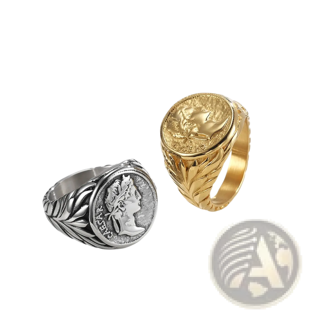 Two vintage caesar portrait stainless steel signet rings in silver with leafy band and gold with engraved medallion designs