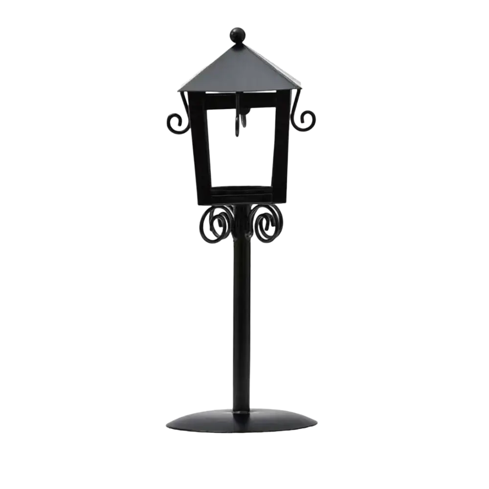 Black wrought iron vintage candle holder lantern with ornate scrollwork and glass panels for decorative use