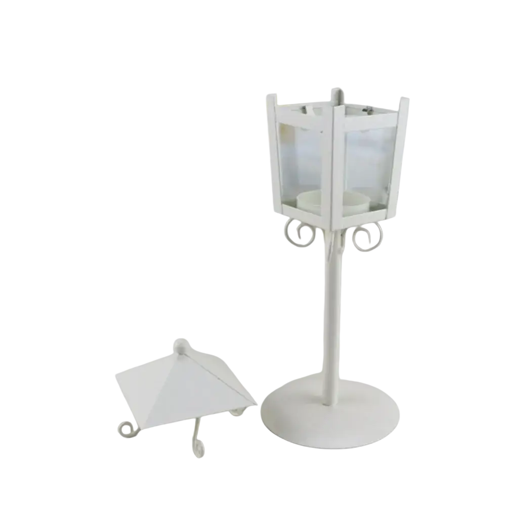 White metal vintage candle holder lantern with clear glass panels and decorative base for home decor use