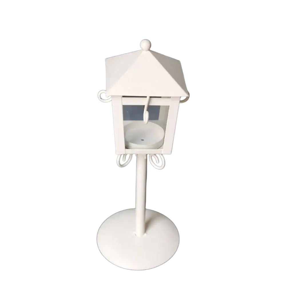 White metal vintage candle holder lantern with hexagonal top, decorative scrollwork, glass panel, and interior candle holder
