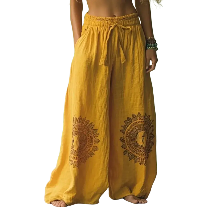 Yellow vintage casual wide leg pants with embroidered sun and face designs in a casual pants style